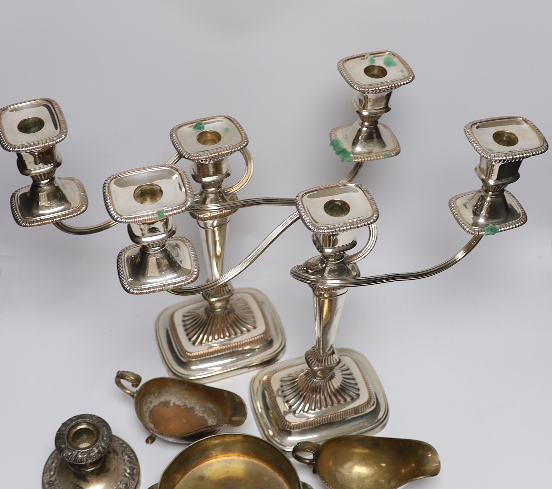 A pair of silver plated on copper twin branch three light candelabra, a 